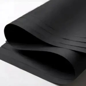Curled sheet of deep matt black paper