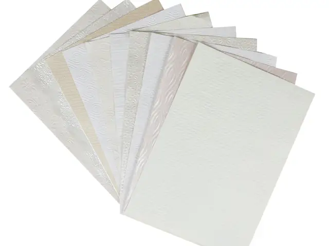Fanned sheets of textured paper in assorted finishes
